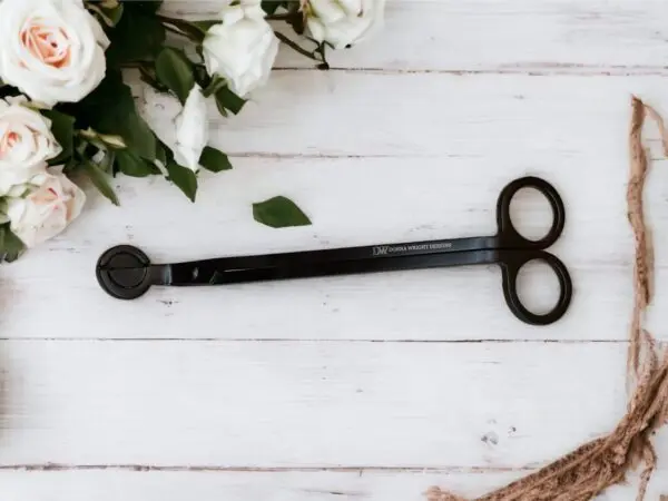 A pair of scissors sitting on top of a table.