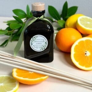 Luxury olive leaves and neroli reed diffuser in dark glass vessel with natural reeds