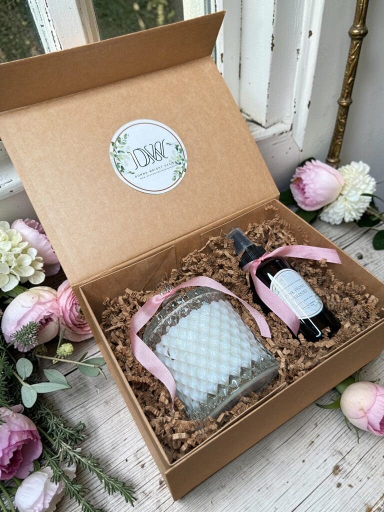 Luxury Mother's Day gift box with cut glass candle and room spray tied with olive green satin ribbon.