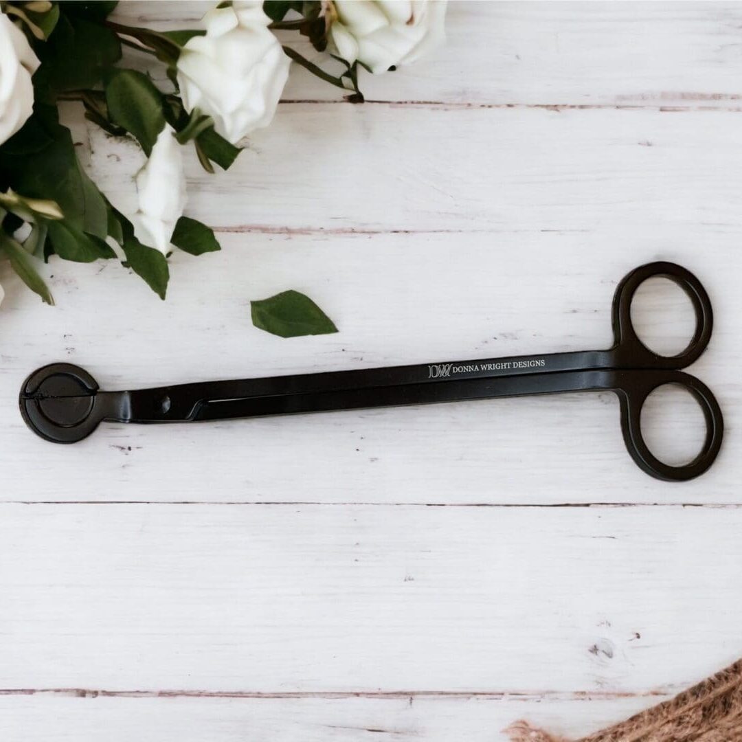 A pair of scissors sitting on top of a table.